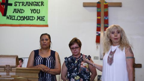 Francisca Lino, left, and Evelia Romero, center, listen as Pastor Emma Lozono speaks to the congregation about immigration during a service at Adalberto United Methodist Church in Chicago, on July 14. Both Lino and Romero are living in sanctuary to avoid deportation. 