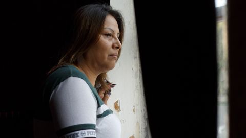 Francisca Lino looks out onto the street outside Adalberto United Methodist Church in Chicago on July 13.