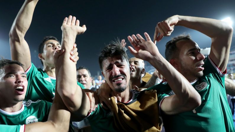 Algeria's forward Baghdad Bounedjah cries as he celebrates after winning the 2019 Africa Cup of Nations (CAN) quarter final football match against Ivory Coast at the Suez Stadium in Egypt.
