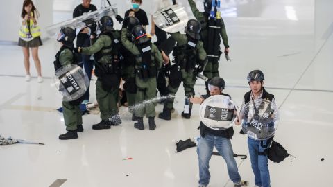 Riot police deploy pepper spray inside the New Town Plaza shopping mall during a protest in the Sha Tin district of Hong Kong on July 14, 2019. 
