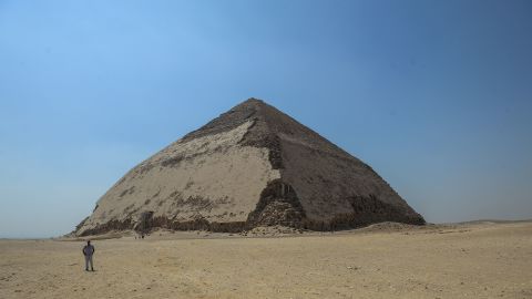 TOPSHOT - A picture taken on July 13, 2019 shows the Bent pyramid of King Sneferu, the first pharaoh of Egypt's 4th dynasty, in the ancient royal necropolis of Dahshur on the west bank of the Nile River, south of the capital Cairo. - An Egyptian archaeological mission discovered a collection of stone, clay and wooden sarcophagi, of which some are still containing well preserved mummies, as well as a collection of wooden funerary masks and instruments used in cutting stones. Mohamed el-Shahed/AFP/Getty Images
