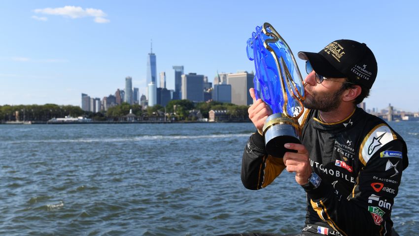 NEW YORK, NY - JULY 13: In this handout from FIA Formula E Jean-Eric Vergne (FRA), DS TECHEETAH, with his championship trophy overlooking New York  during the New York E-Prix, Race 12 of the 2018/19 ABB FIA Formula E Championship at Brooklyn Street Circuit  {Photo by FIA ABB Formula-E Handout/Getty Images,)