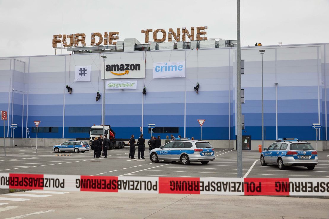 Greenpeace activists abseil down the Amazon Logistik Winsen GmbH building, protested against the destruction of returned new goods ahead of "Prime-Day".