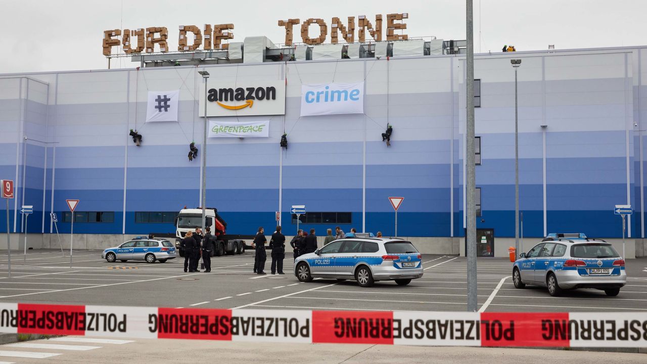 Greenpeace activists abseil down the Amazon Logistik Winsen GmbH building, protested against the destruction of returned new goods ahead of "Prime-Day".