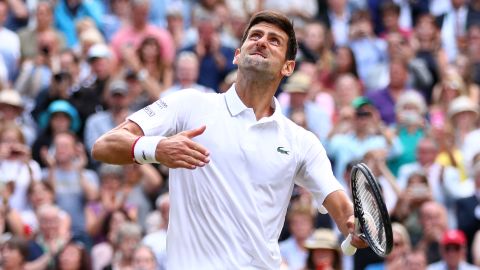 Djokovic celebrates defeating Roger Federer to win his fifth Wimbledon title. 