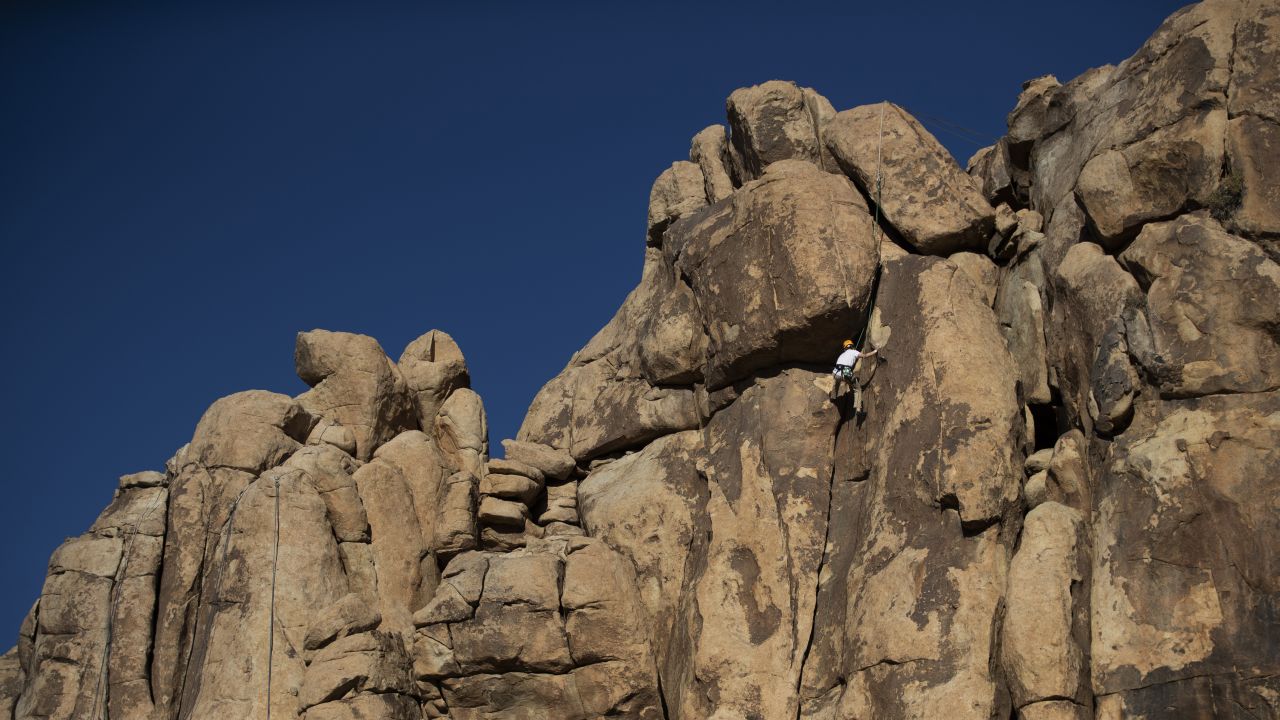 <strong>Rock climbing at Joshua Tree National Park (California): </strong>A climber takes on a rock face at Joshua Tree, which features thousands of possible climbing routes.