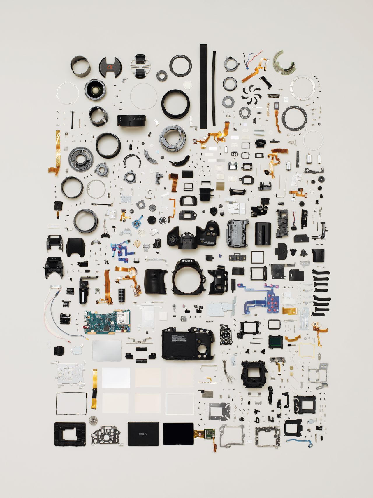 Featuring 580 separate parts, this digital SLR camera is one of the most complex objects in the book. McLellan tries to understand what each component does before creating his compositions.