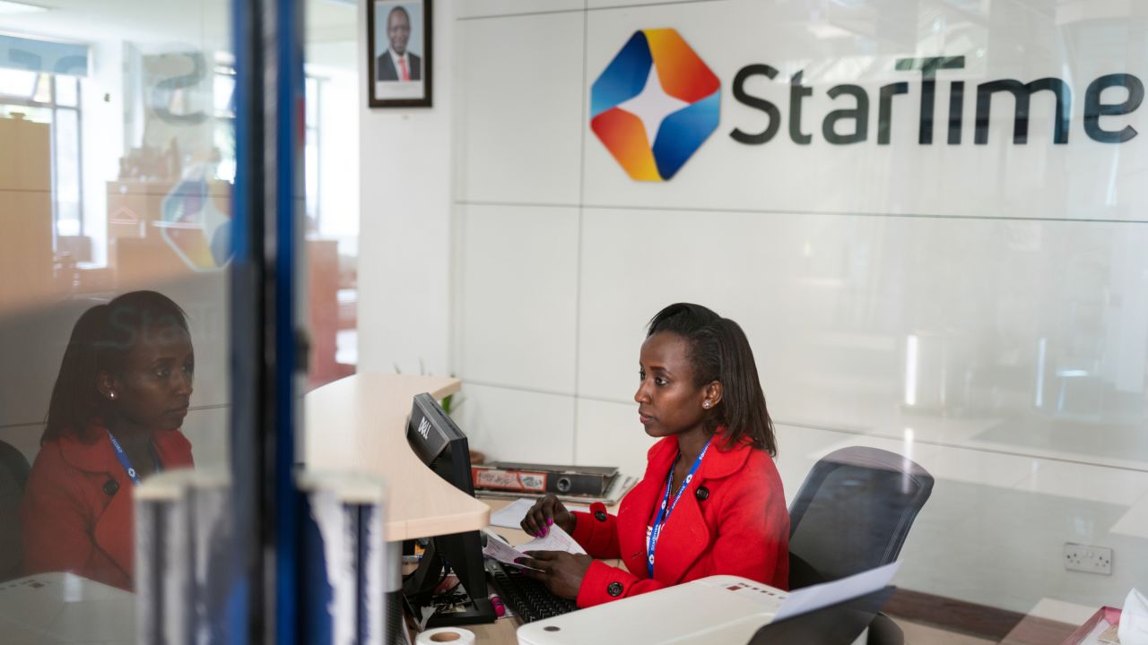 A receptionist sits at her desk in the lobby of the StarTimes headquarters in Nairobi.