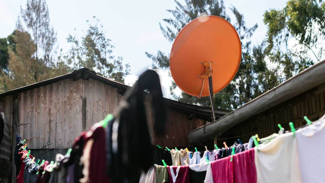 An orange StarTimes satellite sits atop a home in the Ndumbuini village.
