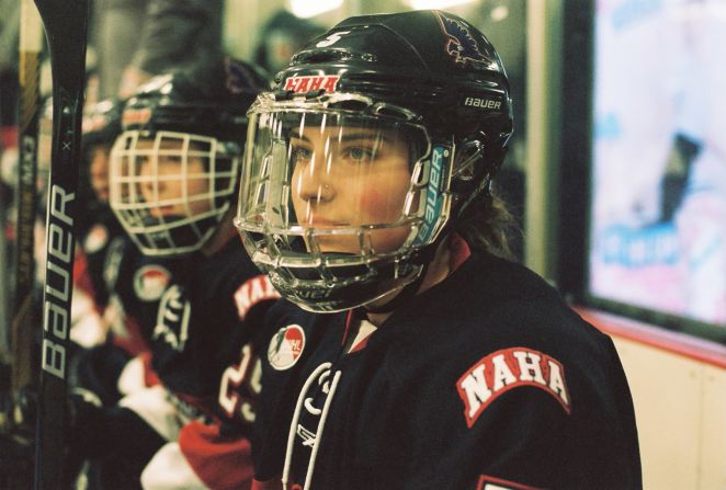 For "Title IX", Paterson worked with 14 women's high school and college-level hockey teams from the U.S. and Canada. 