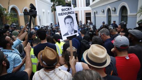Police block the street leading to the governor's mansion on Sunday.