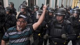 Police block demonstrators from advancing to La Fortaleza governor's residence in San Juan, Puerto Rico.