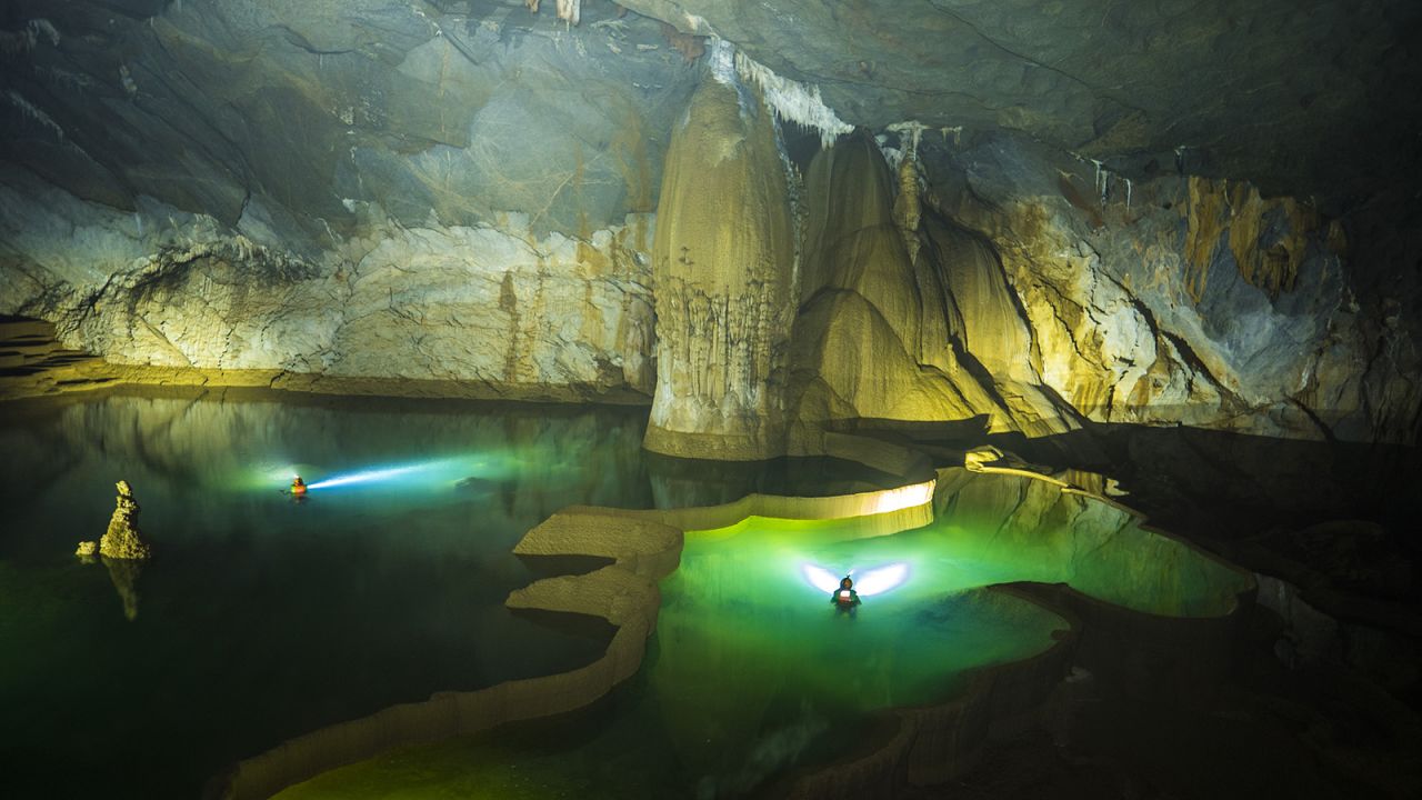 <strong>Hang Va:</strong> A 100-meter swim through the river passage connects you to the entrance of Hang Va cave, known for its extraordinary stalagmite field. 