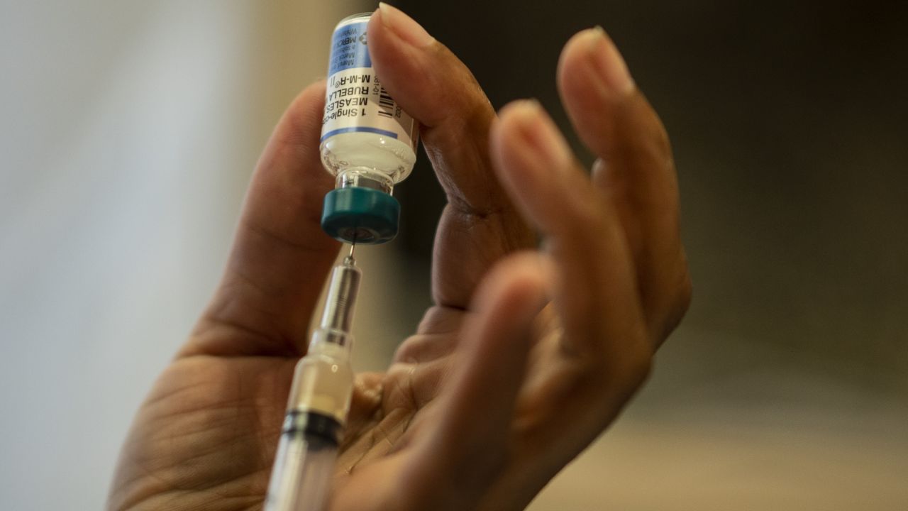 This picture taken on April 5, 2019 shows a nurse preparing the measles, mumps and rubella vaccine at the Rockland County Health Department in Haverstraw, Rockland County, New York. - A measles outbreak in the area has sickened scores of people and caused the county to bar unvaccinated minors in public places. (Photo by Johannes EISELE / AFP) / With AFP Story by Catherine TRIOMPHE: NY county measles outbreak spotlights vaccine religious exemptions        (Photo credit should read JOHANNES EISELE/AFP/Getty Images)