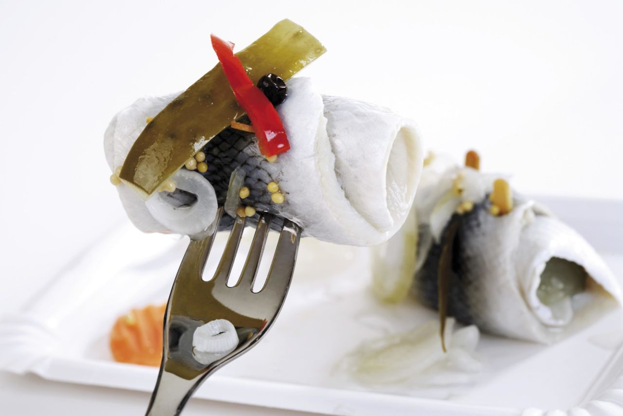 <strong>Rollmops: </strong>Served on the coast since medieval times, these pickled herring fillets are typically rolled around a savory filling like a pickled gherkin.