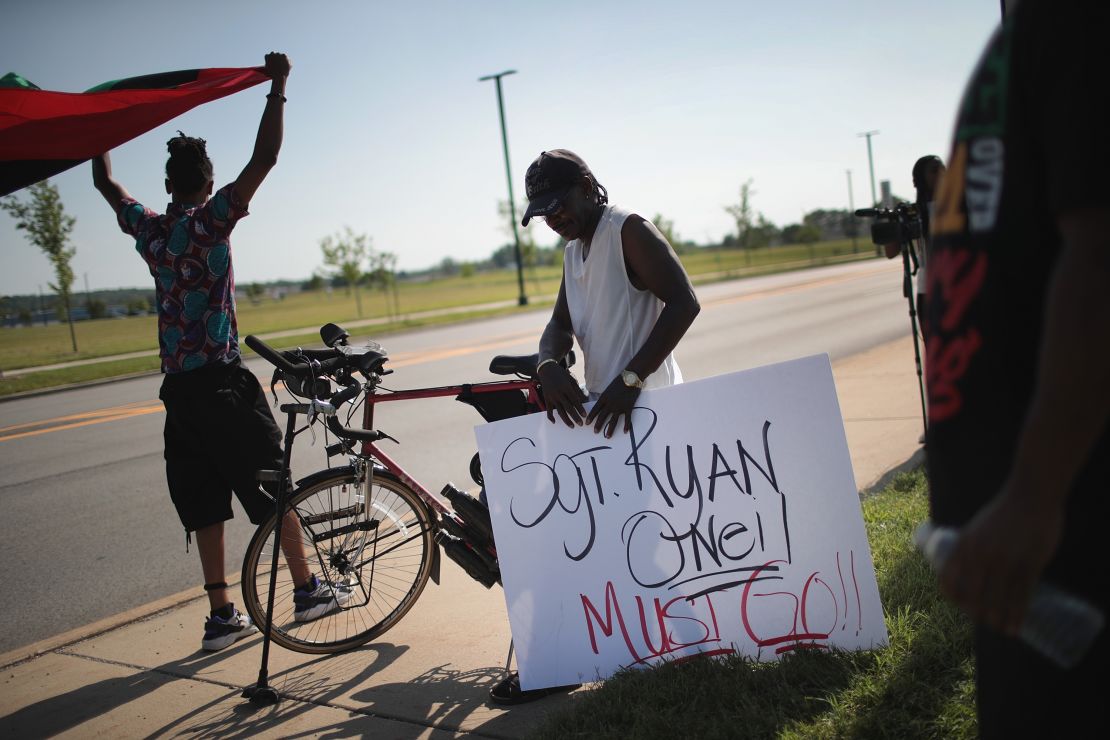 Demonstrators protest the shooting death of Eric Logan outside of the South Bend Police Station after his funeral on June 29.