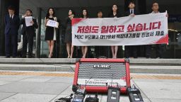 South Korean news presenters of the local TV network Munhwa Broadcasting Corporation hold a rally before submitting a complaint on workplace harassment to the employment and labor office in Seoul on July 16, 2019. 