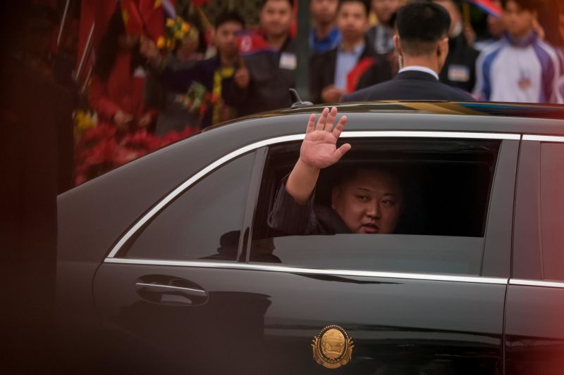 Kim Jong Un waves from his car upon his arrival in Vietnam on February 26 to attend the second US-North Korea summit.