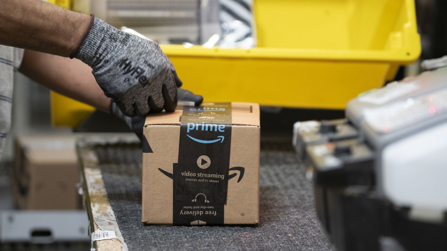 In this  April 30, 2019, file photo, an employee places a label on a box at the Amazon.com Inc. fulfillment center in Baltimore.