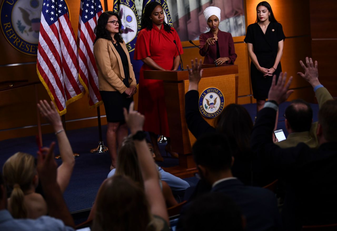 Omar, who with Tlaib was one of the first two Muslim women elected to Congress, answers questions from the media at their news conference Monday. During her remarks, Omar said Trump's attack to "go back" to their home countries, was a familiar slur hurled at people of color. "Every single person who is brown or black, at some point in their life in this country, heard that," she said.