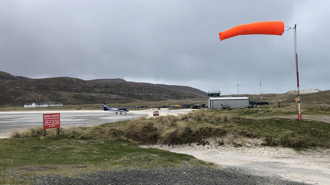 The windsock flies in a strong breeze at Traigh Mhòr beach.