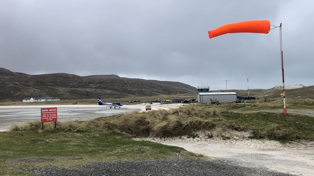 <strong>The 'runway': </strong>Near the northern tip of the island an orange windsock stands out against the grassy sand dunes and wide bay of Traigh Mhòr beach.