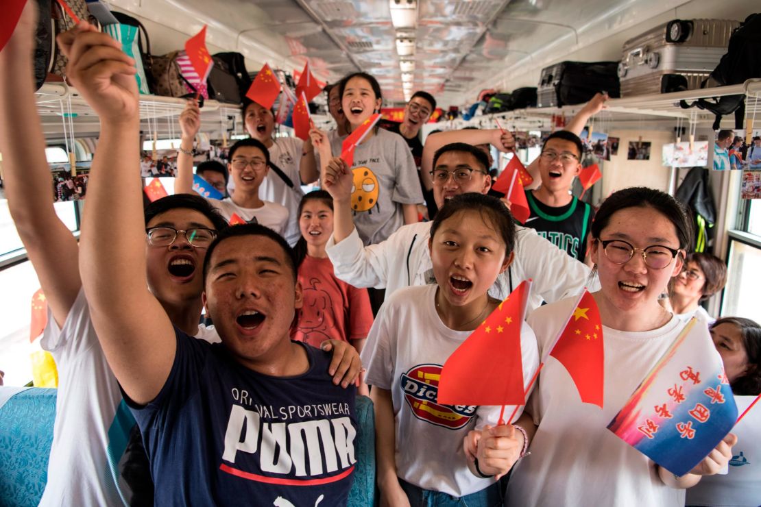 Students board a "gaokao train" at Dayangshu township on June 5 in the Inner Mongolia Autonomous Region, China.