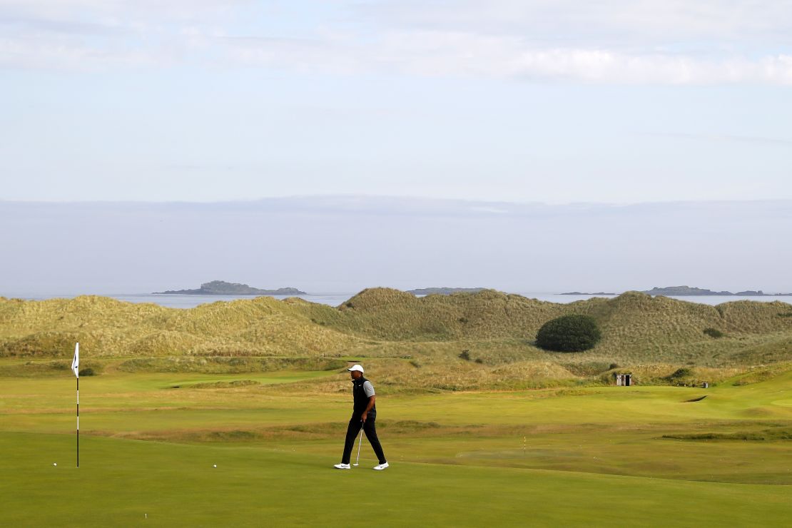Tiger Woods walks onto a green during practice for The Open at Royal Portrush.