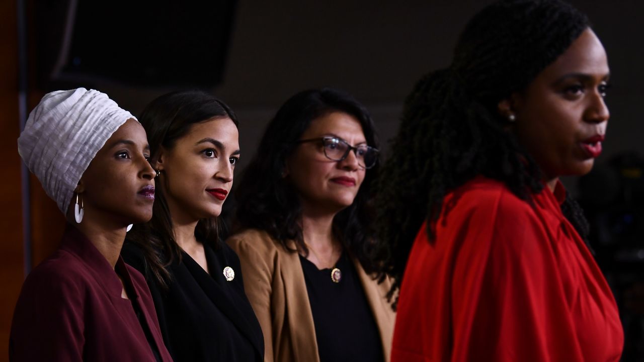 Rep. Ayanna Pressley speaks as her colleagues listen - from left, Rep Ilhan Omar, Rep. Alexandria Ocasio-Cortez and Rep. Rashida Tlaib.