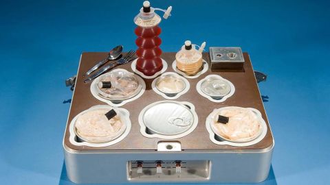 The Skylab food tray with individual heated canned food compartments. 