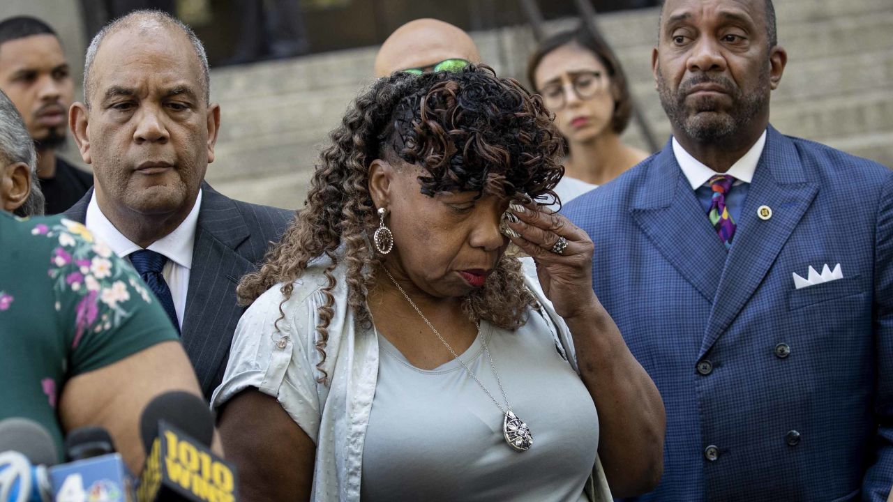 Eric Garner's mother Gwen Carr wiped away tears after speaking to reporters outside the US Attorney's office on Tuesday.