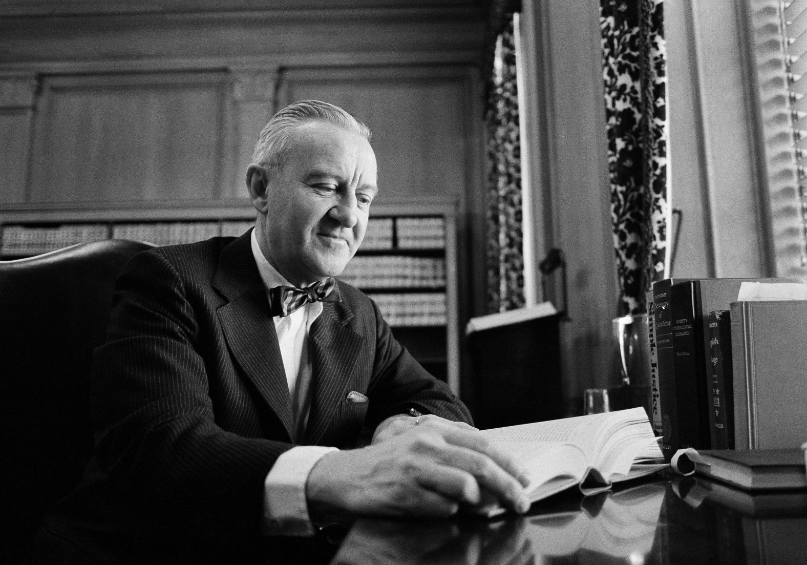 Stevens looks over some legal material on January 12, 1976, in his chambers in Washington prior to joining his colleagues for his first working session on the Supreme Court bench.