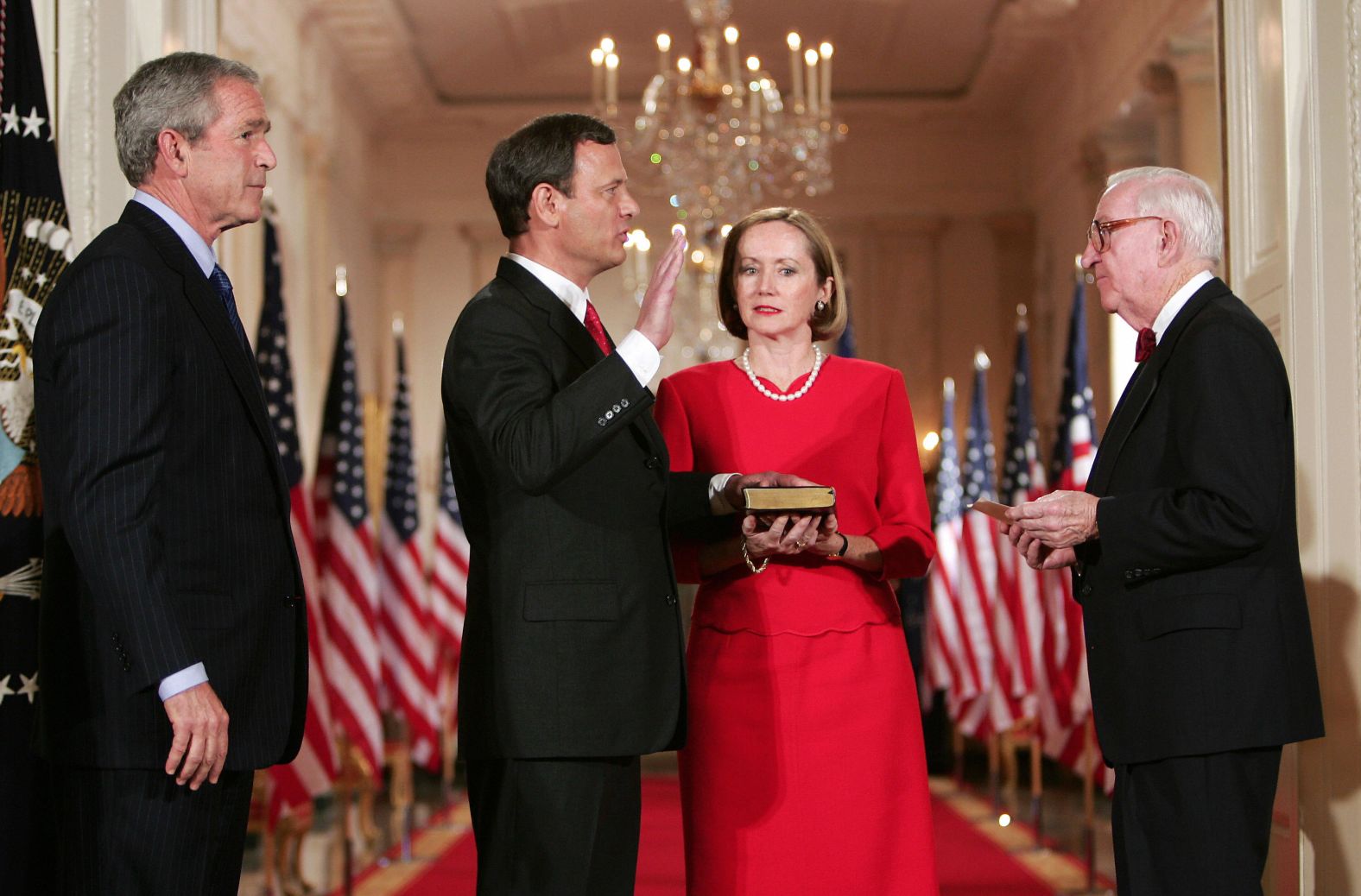 Judge John Roberts, second left, is sworn in as US Supreme Court Chief Justice on September 29, 2005, at the White House by Stevens, right, before his wife, Jane, second right, and President George W. Bush.