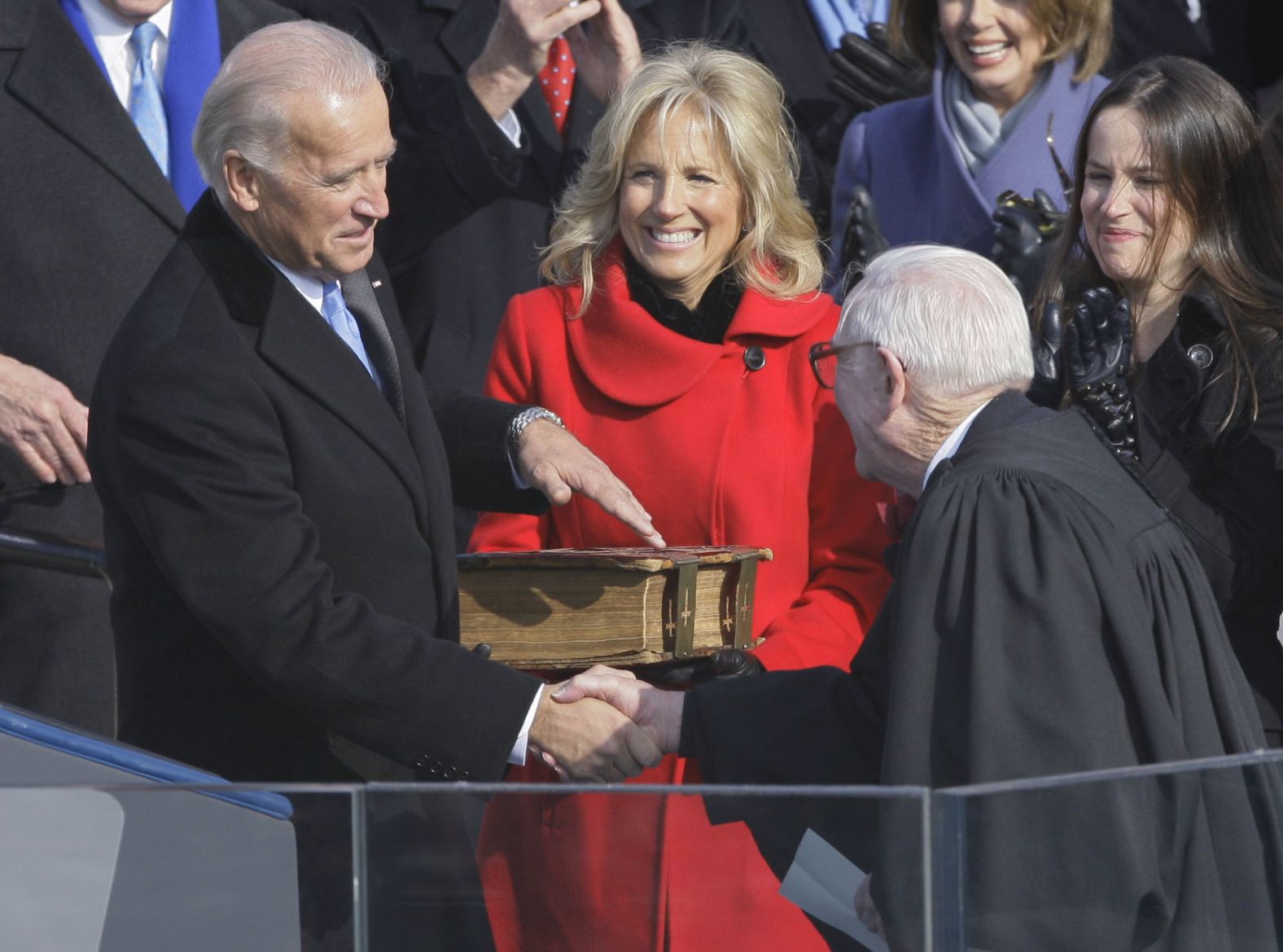 Former Vice President Joe Biden shakes hands with Stevens after taking the oath of office on January 20, 2009. Biden's wife, Jill, is at his side.