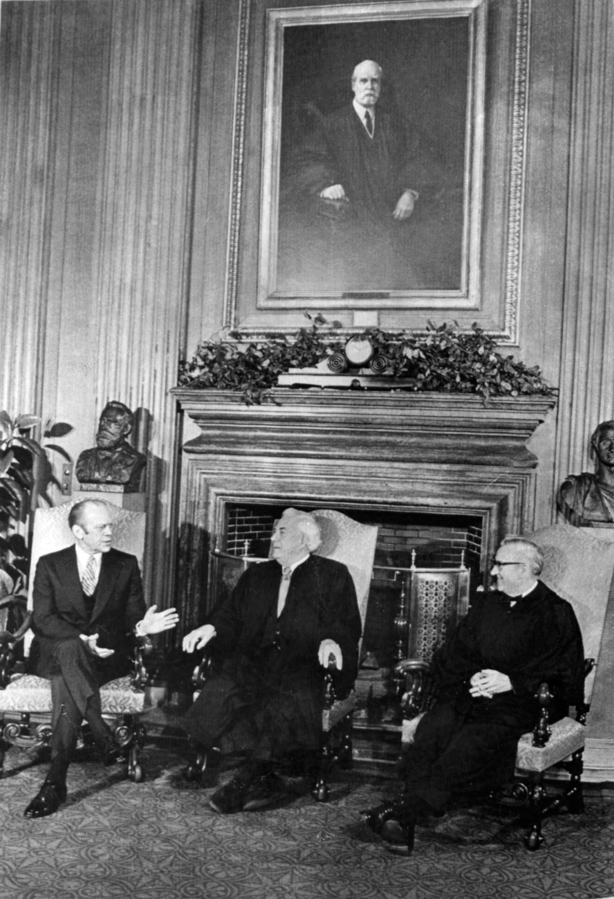 Chief Justice Warren Burger, center, with fellow Justice Stevens and President Gerald Ford in Washington on December 19, 1975. Ford nominated Stevens as an associate justice in 1975 to replace Justice William O. Douglas, who had retired. Stevens took his seat December 19, 1975, after being confirmed nearly unanimously by the Senate.