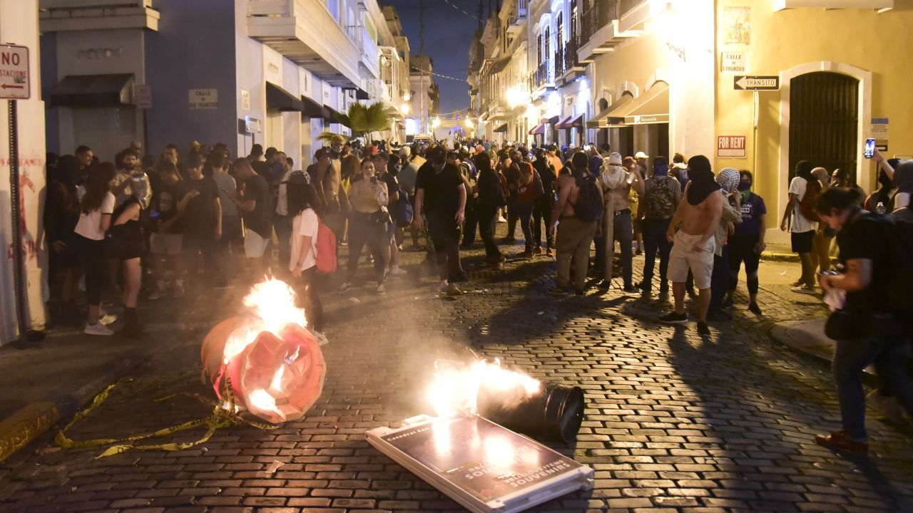 Protesters filling the street in front of the governor's mansion in Old San Juan clashed with police.