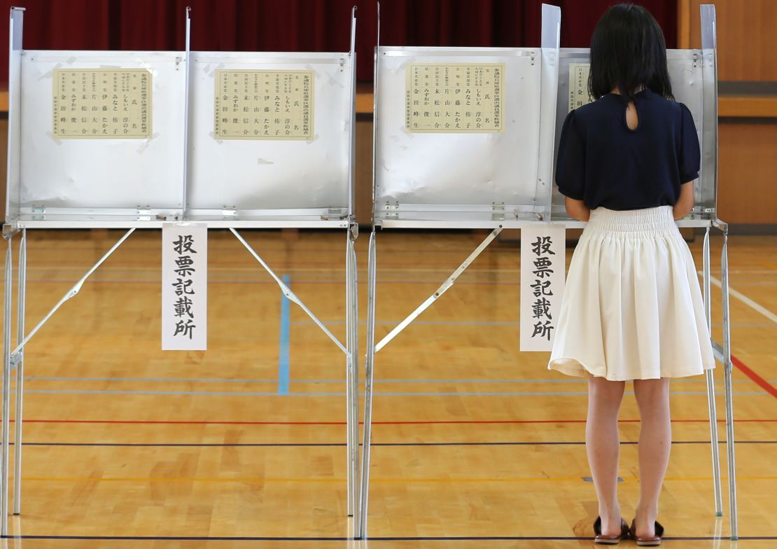 An 18-year-old woman casts her vote for parliament's upper house election at a polling station on July 10, 2016 in Himeji, Japan. 