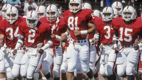 PALO ALTO, CA -  1989:  Cory Booker #81 and his Stanford Cardinal teammates jog on the field during warmups prior to a football game during the 1989 season at Stanford Stadium in Palo Alto, California.  Other visible players include Scott Eschelman #34, Alan Grant #2, Kevin T. Scott #3,  and Gary Taylor #15 