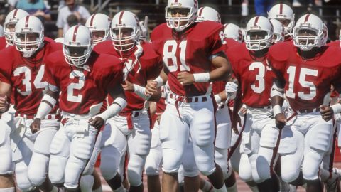 PALO ALTO, CA - 1989: Cory Booker #81 and his Stanford Cardinal teammates jog on the field during warmups prior to a football game during the 1989 season at Stanford Stadium in Palo Alto, California. Other visible players include Scott Eschelman #34, Alan Grant #2, Kevin T. Scott #3, and Gary Taylor #15