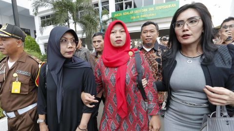Baiq Nuril Maknun, center, arrives at the Attorney General's office in Jakarta, Indonesia on July 12, 2019.