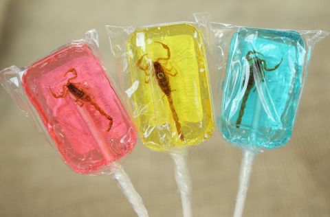 Scorpions suspended in lollipops are sold around the world. Here they are available in strawberry, banana and blueberry. 