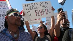 OLD SAN JUAN, PUERTO RICO - JULY 17: Demonstrators protest against Ricardo Rossello, the Governor of Puerto Rico July 17, 2019 in front of the Capitol Building in Old San Juan, Puerto Rico. There have been calls for the Governor to step down after it was revealed that he and top aides were part of a private chat group that contained misogynistic and homophobic messages. (Photo by Joe Raedle/Getty Images)