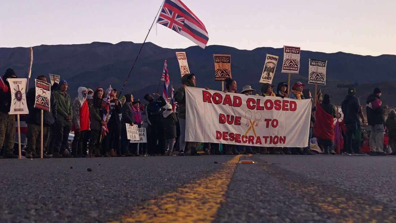 Demonstrators gather to block a road at the base of Hawaii's tallest mountain, Monday, July 15, 2019.