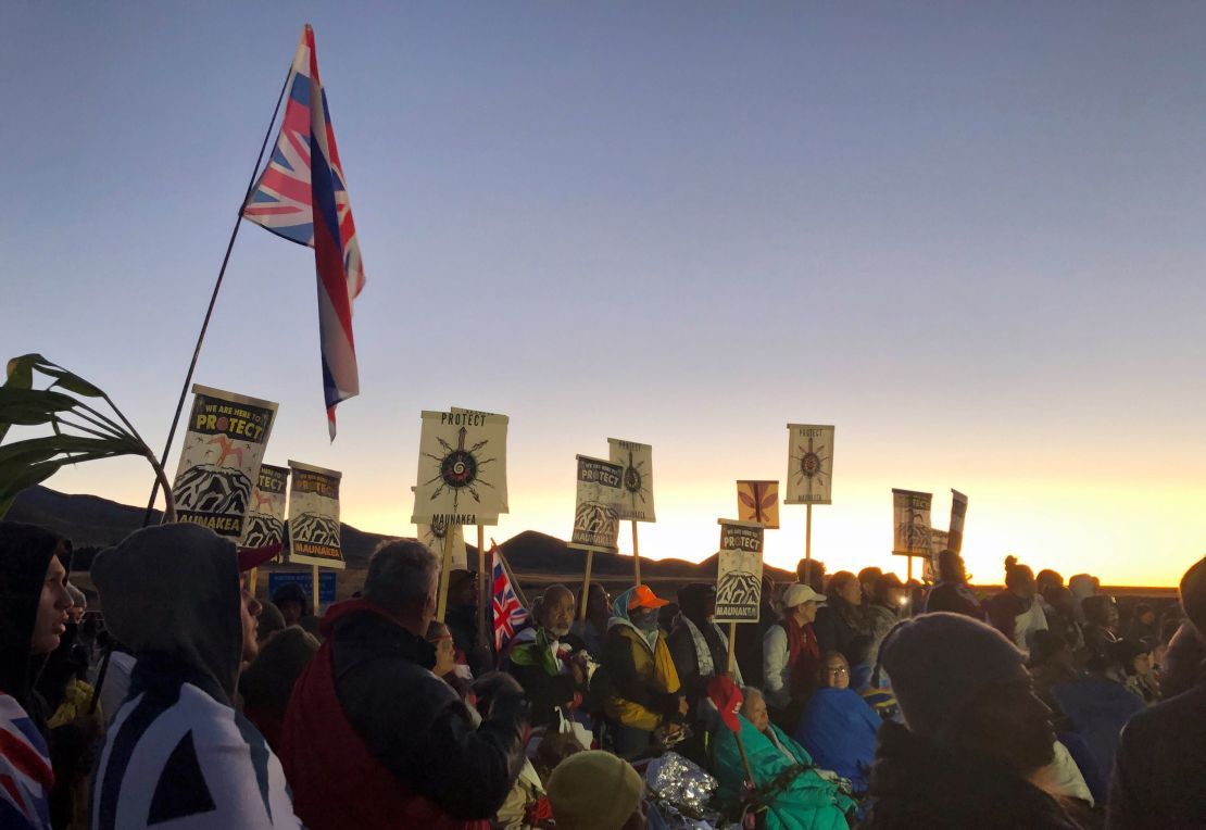 Demonstrators gather to block a road at the base of Hawaii's tallest mountain, Monday, July 15, 2019, in Mauna Kea, Hawaii.