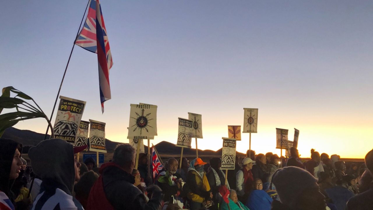 Demonstrators gather to block a road at the base of Hawaii's tallest mountain, Monday, July 15, 2019, in Mauna Kea, Hawaii.