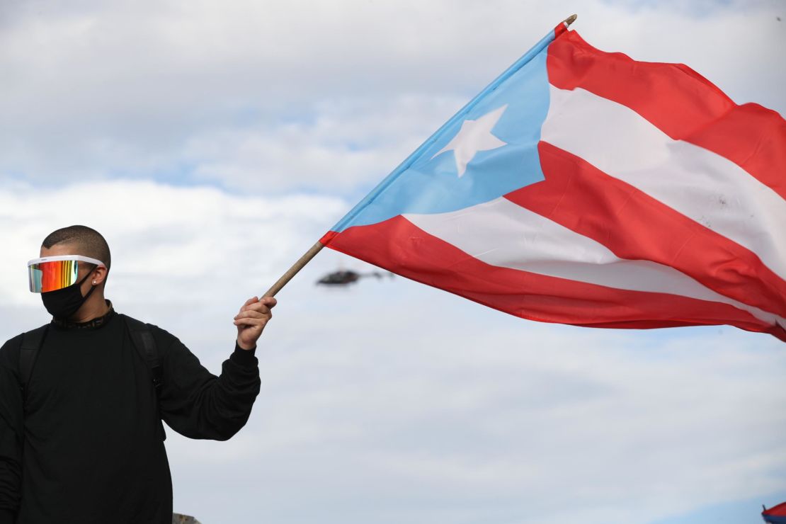 Reggaeton Singer Bad Bunny joins a protest in San Juan, Puerto Rico on Wednesday.