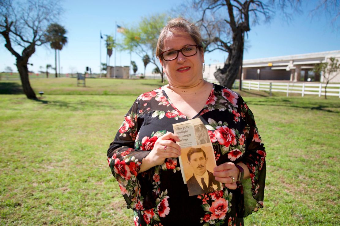 Christine Molis holds a photo of her slain relative.