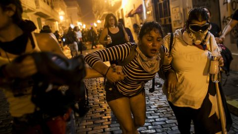 Police officers used tear gas to disperse protesters near the governor's mansion on Wednesday night.