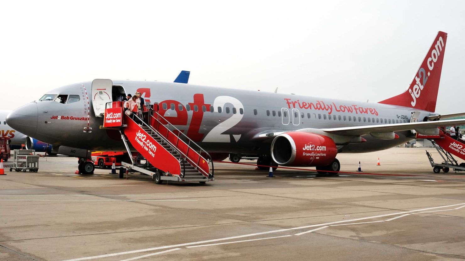 Airline passengers disembark from a Jet2 aircraft at London Stansted Airport in May 2018.