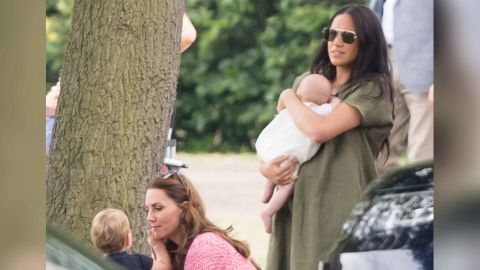 Meghan holds Archie as she and Catherine attend a polo match in Wokingham last week.